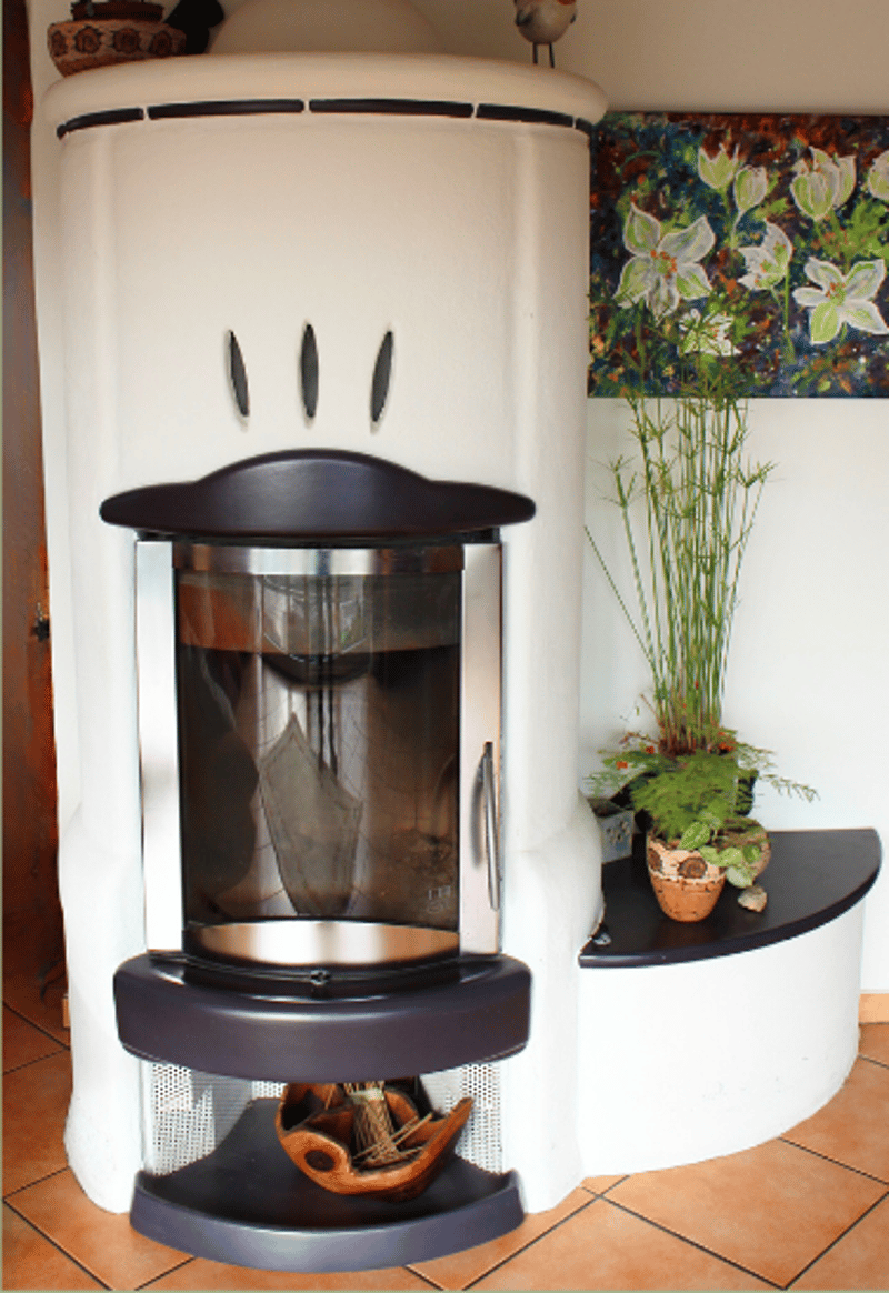 corner fireplace, white wall, two shelves, plant