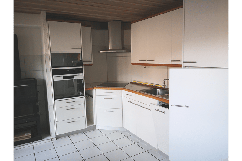 white kitchen cabinets, tiled floor, silver sink, white fridge, dishwasher, oven