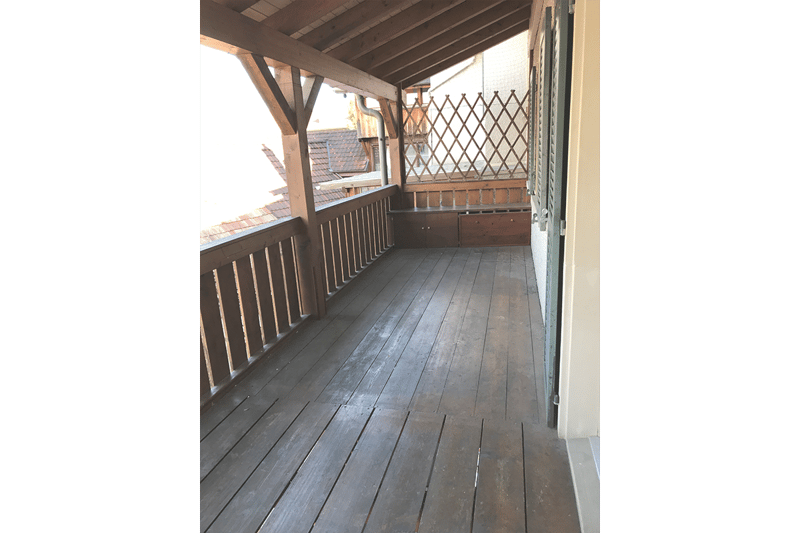 wooden deck, wooden railing, closed door, wooden drawer