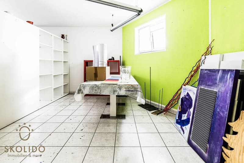 Edificio residenziale con tre appartamenti vacanza e giardino ad Ascona (53)