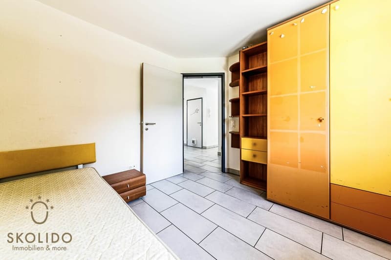 Edificio residenziale con tre appartamenti vacanza e giardino ad Ascona (33)