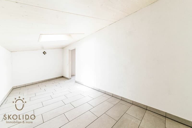 Edificio residenziale con tre appartamenti vacanza e giardino ad Ascona (56)