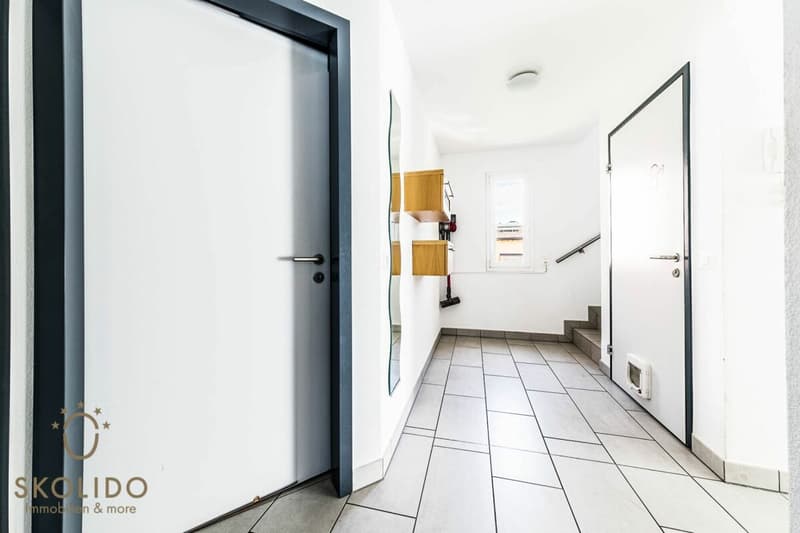 Edificio residenziale con tre appartamenti vacanza e giardino ad Ascona (36)