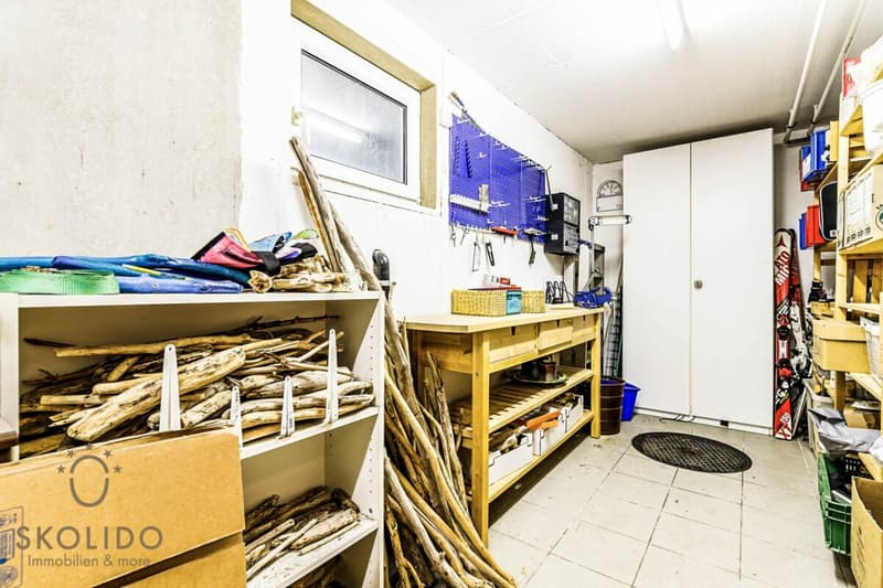 Edificio residenziale con tre appartamenti vacanza e giardino ad Ascona (54)