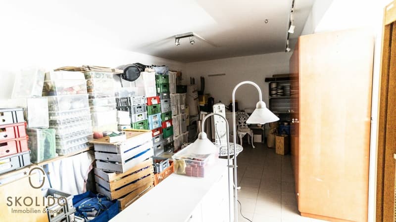 Village shop, large restaurant with terrace, duplex apartment, garages, and building land in the heart of Mund (18)