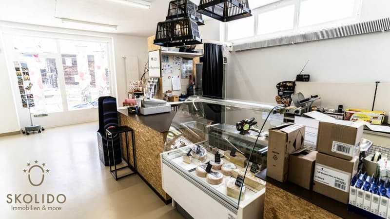 Village shop, large restaurant with terrace, duplex apartment, garages, and building land in the heart of Mund (25)