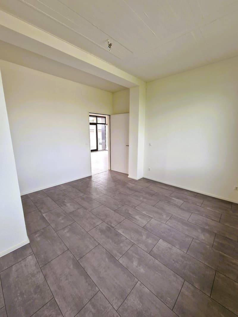 empty room, white walls, gray tile floor, open door, glass window