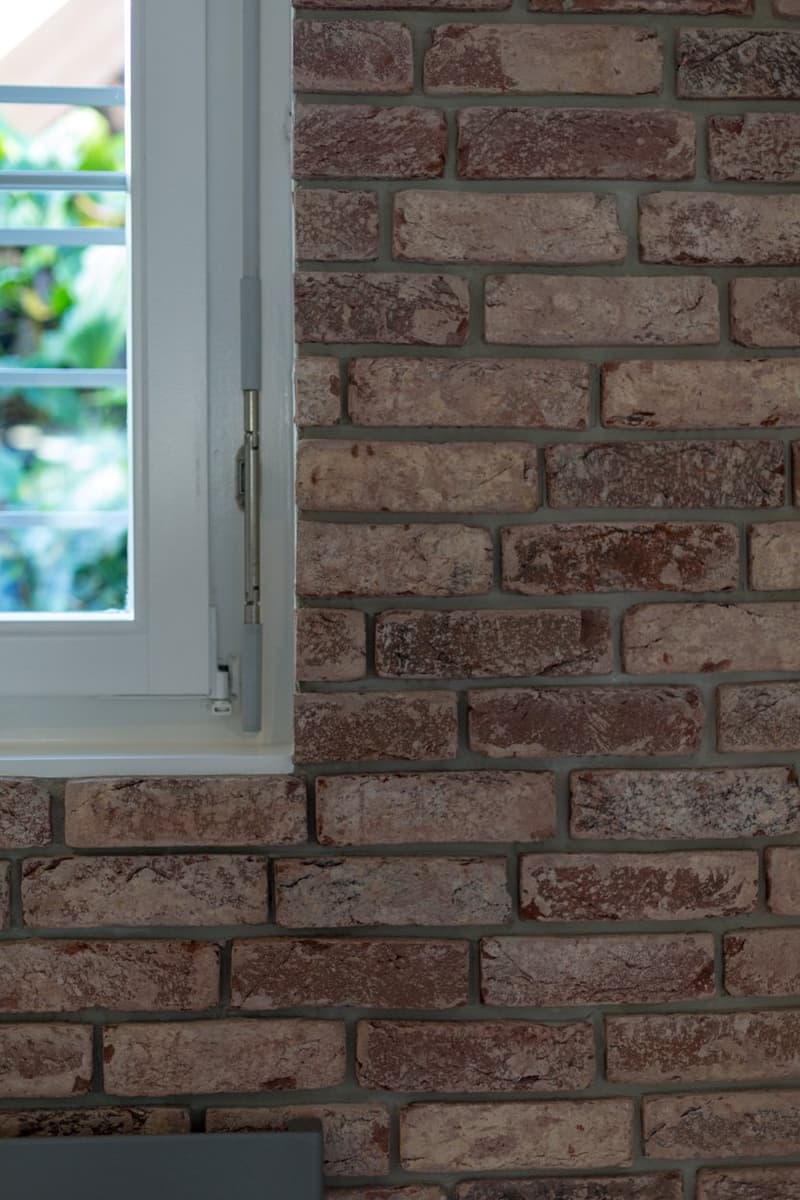 white window, brick wall