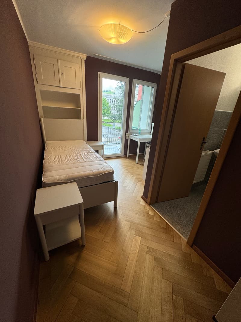 small bedroom with bed, bedside table, wardrobe, desk, chair, balcony, window, radiator