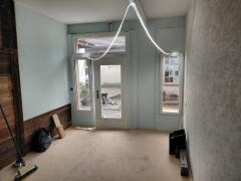 empty room, entrance door, windows, beige carpet