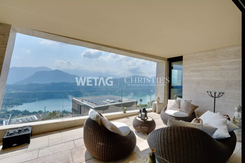 Zum Verkauf in Lugano-Vernate: Moderne Attikawohnung mit spektakulärer Aussicht auf den Luganersee & privatem Garten (1)