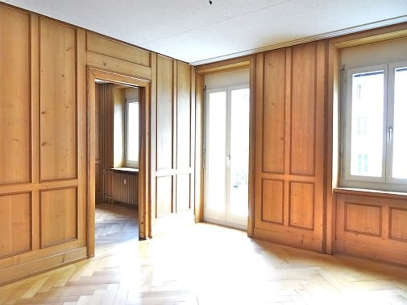 empty room, wooden walls, wooden floor, large windows