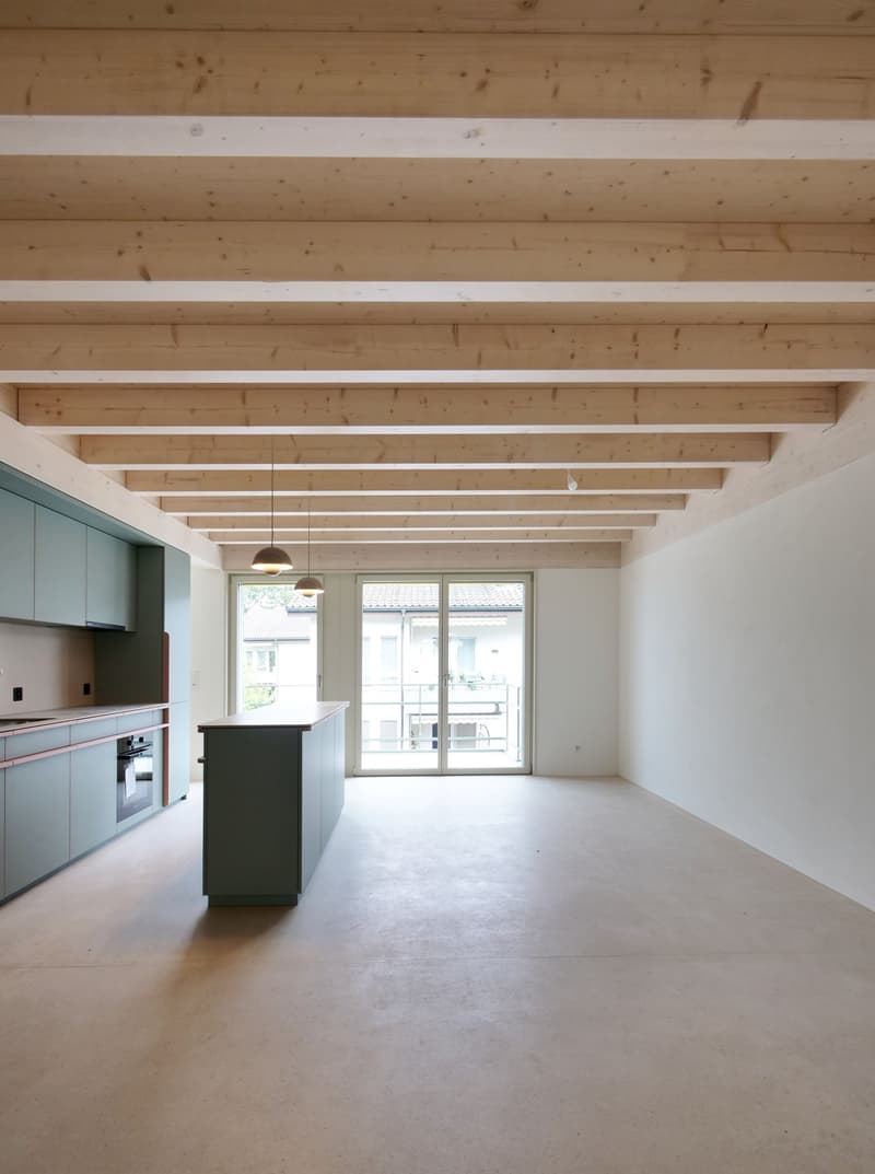 kitchen, island, large windows, exposed wooden beams