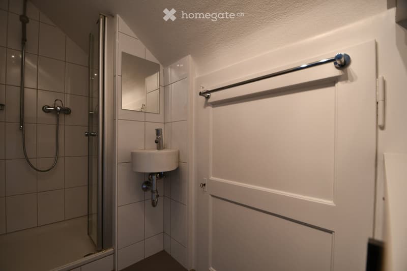 white tiles, shower, sink, mirror