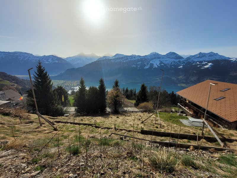 property with a beautiful view of the mountains and a lake