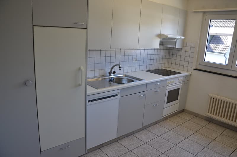 modern kitchen with white cabinets, tiled floor, stainless steel sink, electric stove, dishwasher, refrigerator, and a window