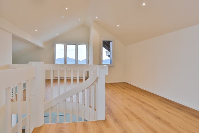 Spiral staircase, wooden floor, large windows, attic