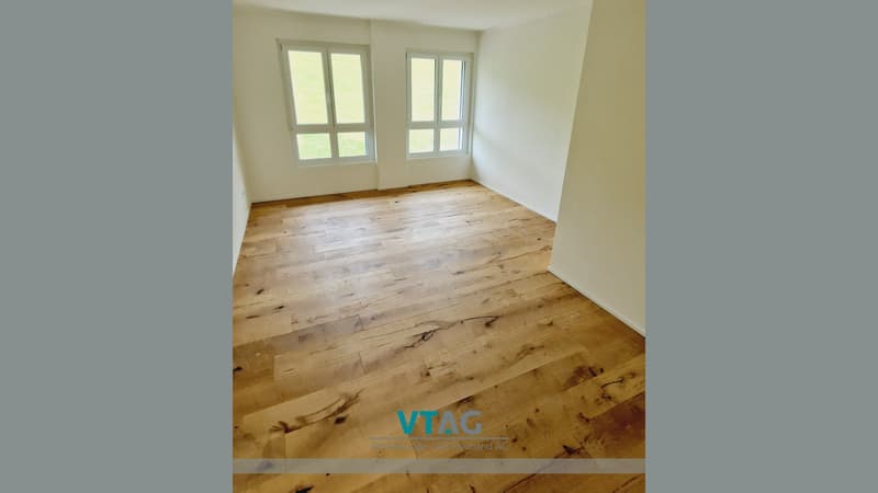 empty room, wooden floor, white walls, two windows