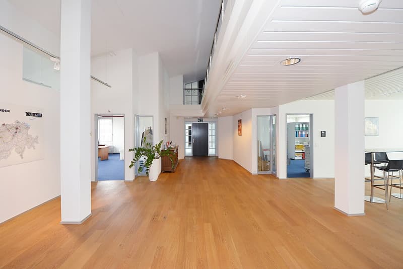 corridor, wooden floor, white walls, several rooms, table and chairs