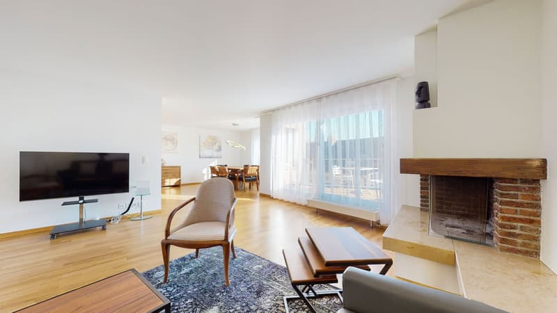 wood floor, fireplace, TV, windows, stackable tables, armchair, grey couch