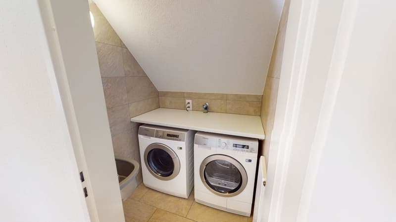 Two washing machines, under counter shelf, sink