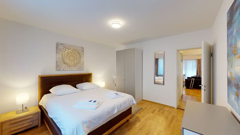 bedroom, large bed, nightstands, lamp, closet, mirror, open door