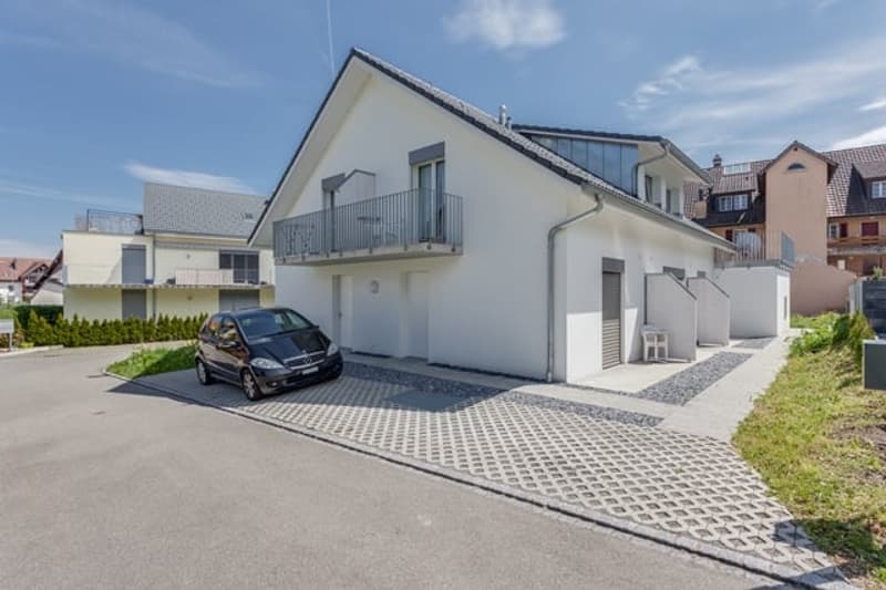 2 story house, white exterior, balcony, garage, driveway