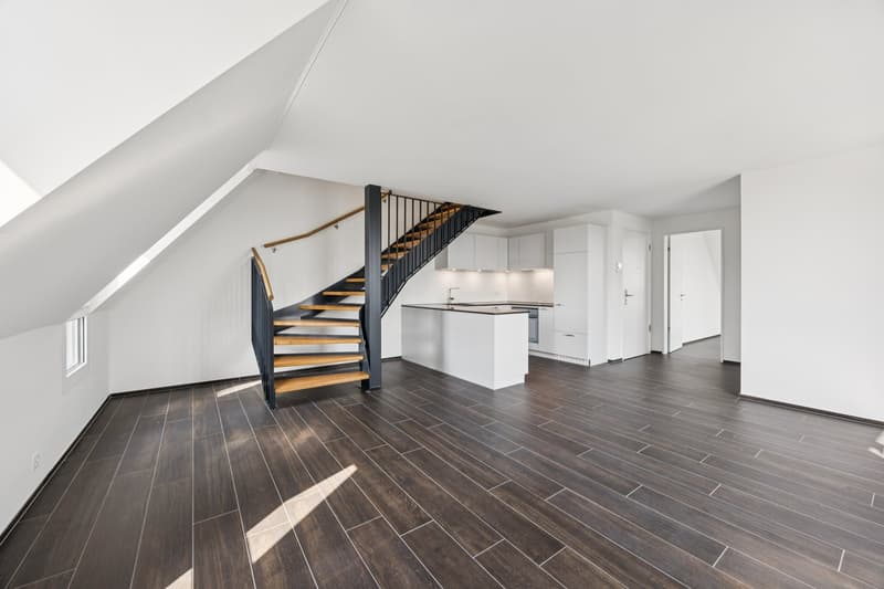 Contemporary design, white walls, wooden floor, open staircase, kitchen area