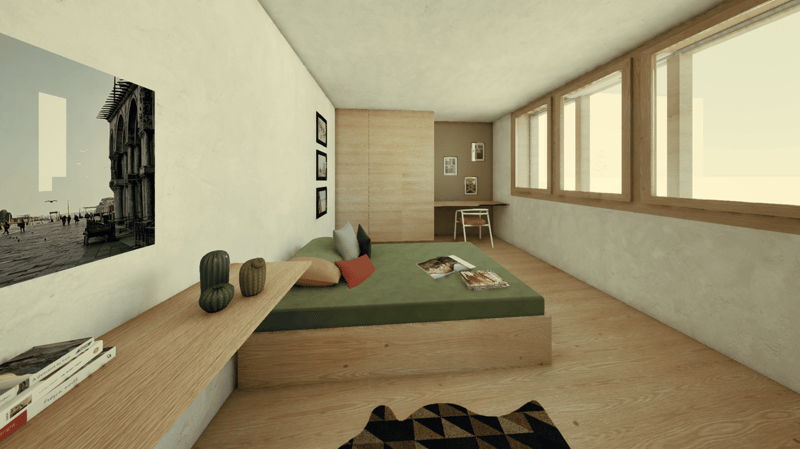 Spacious bedroom with wooden flooring, large windows, a built-in bed platform with green bedding, and decorative accents such as framed artwork and cushions. The room has a minimalist and modern design aesthetic.