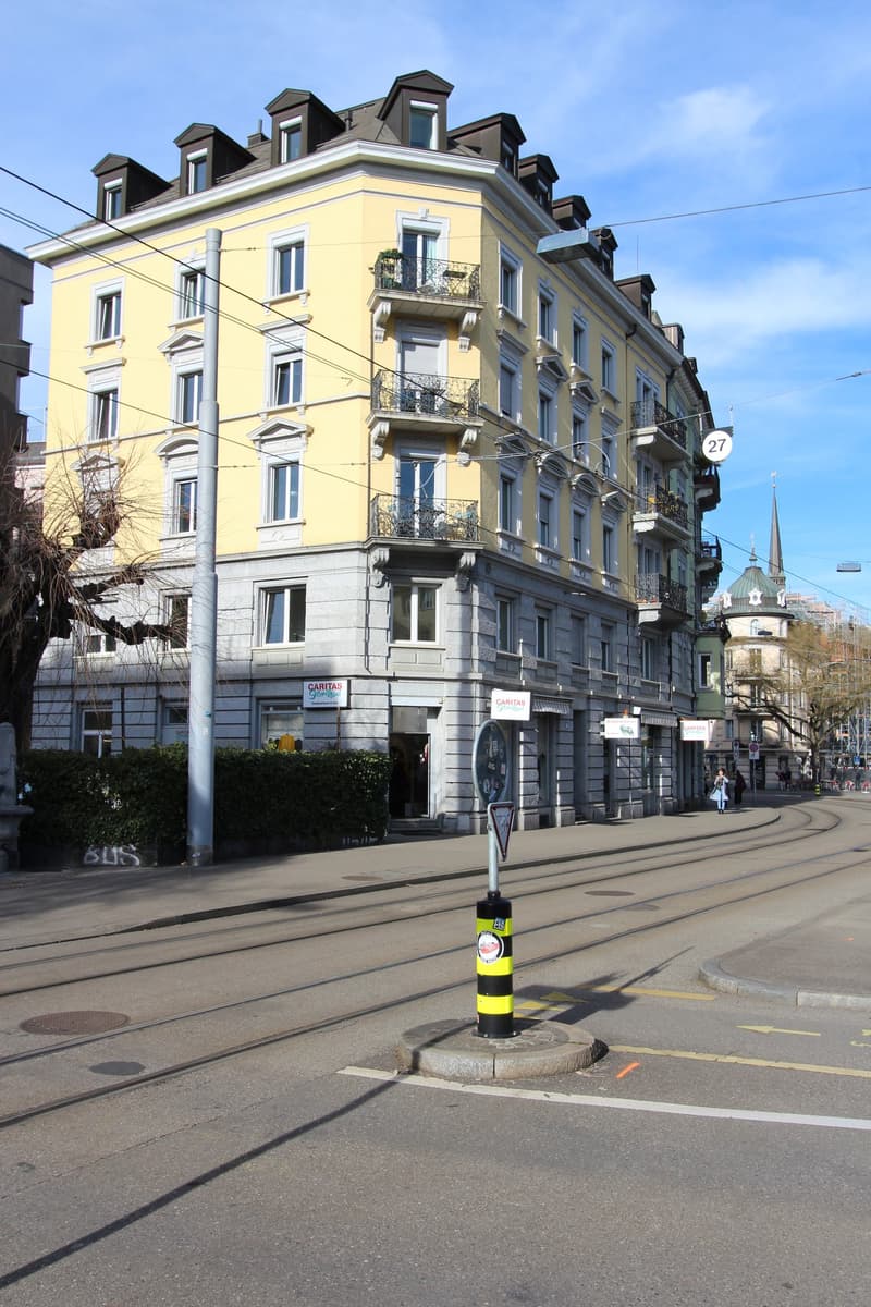 yellow building, multiple balconies, street, tram tracks