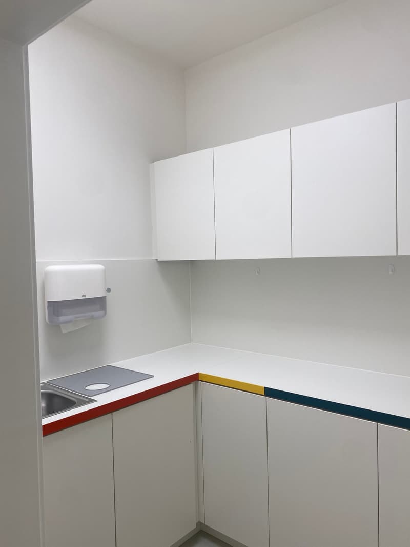 White cabinets, white countertop, sink, dishwasher, minimal decor