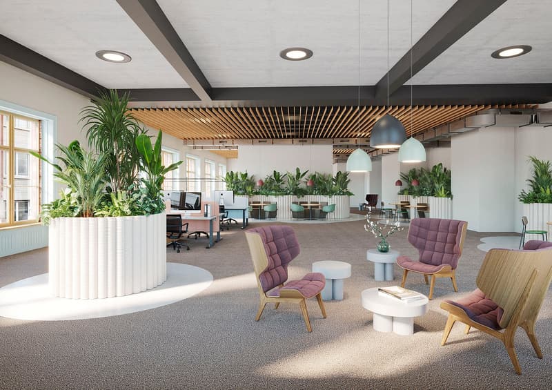 Spacious open-plan office with modern design elements, including a wooden slatted ceiling, large windows, and various seating areas with plush furniture. The space features potted plants and greenery, creating a natural and relaxing atmosphere. There are