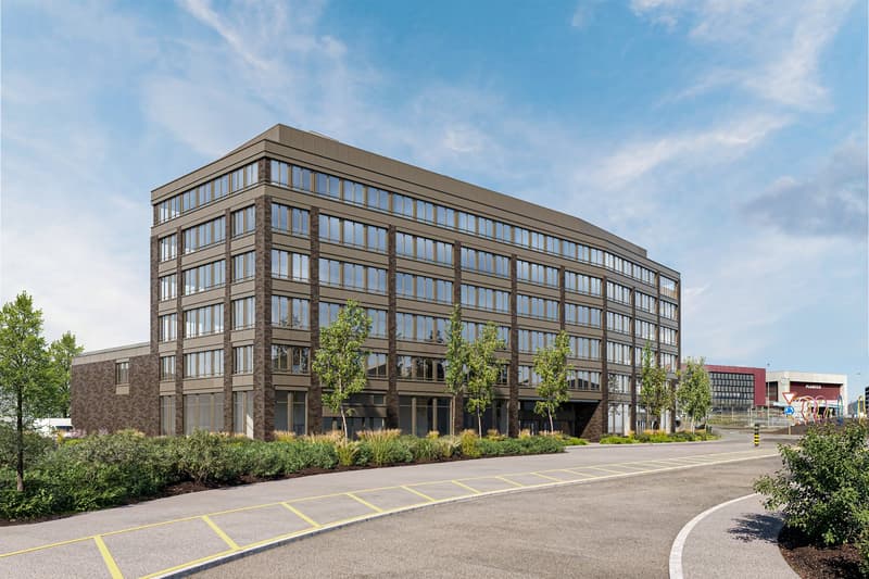 modern office building, multiple floors, large windows, brown exterior, parking area