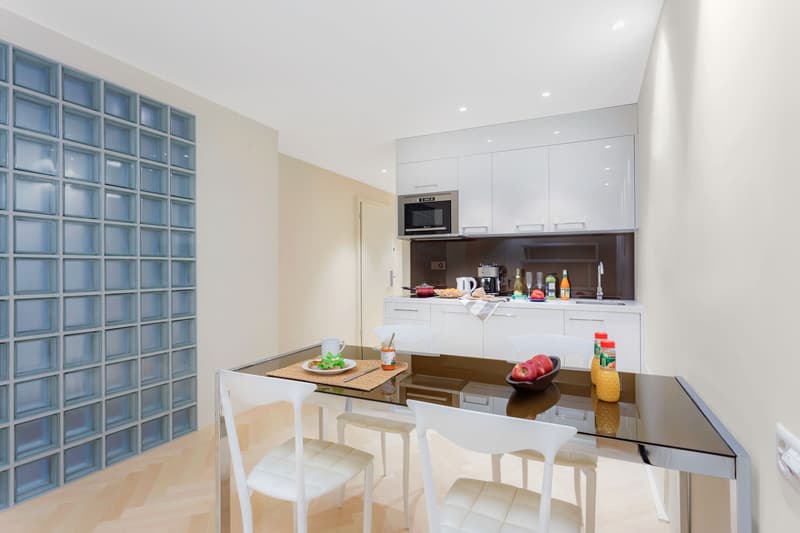 modern, white cabinets, built-in dishwasher, integrated microwave, white dining table, white chairs