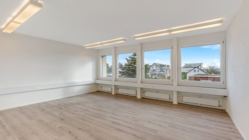 empty room, wooden floor, white walls, large windows, built-in benches, ceiling lights