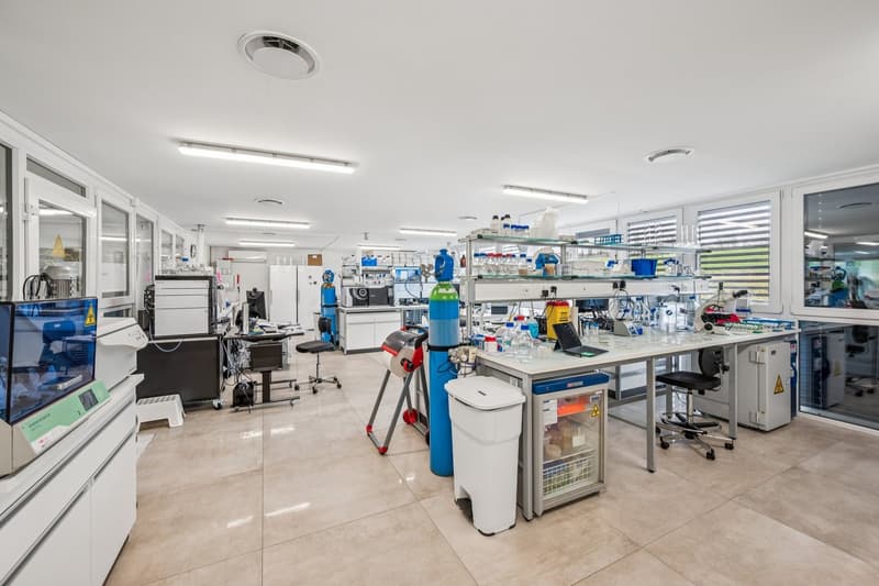 modern laboratory, tiled floor, glass doors, lab equipment, work tables, cabinets, white walls, round exhaust hoods