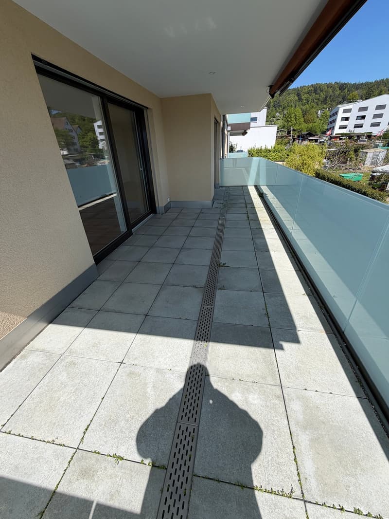tiled floor, glass railing, shadow, view of the mountains