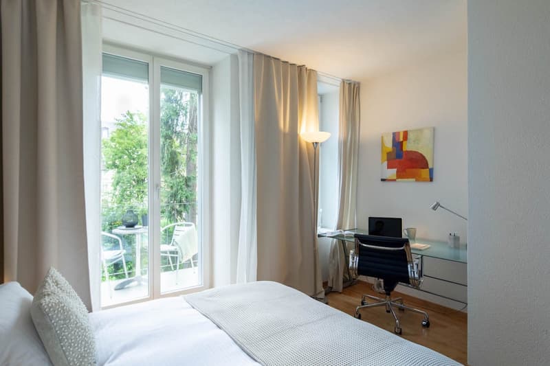 Double bed, pillows, bedroom rug, office chair, desk, painting, floor lamp, sliding door, outdoor terrace, table and chairs
