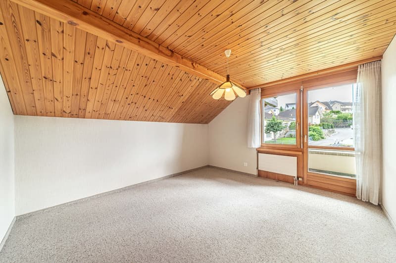 carpeted floor, wooden ceiling, large windows, sliding doors, heater