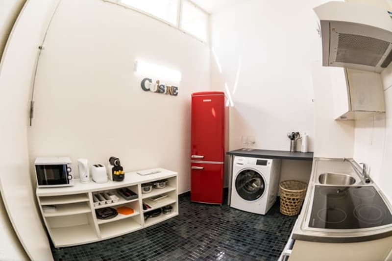 modern kitchen with washing machine and dishwasher