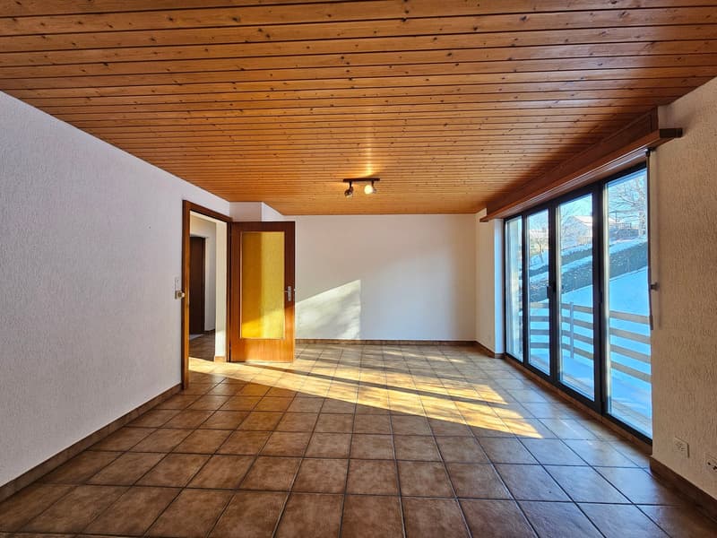 empty room, tiled flooring, wooden ceiling, large glass windows, two doors, white walls