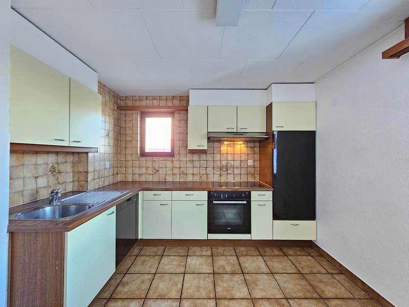 modern kitchen with wooden countertops, stainless steel sink, dishwasher, oven, refrigerator, tiled flooring, tiled walls, cabinet space