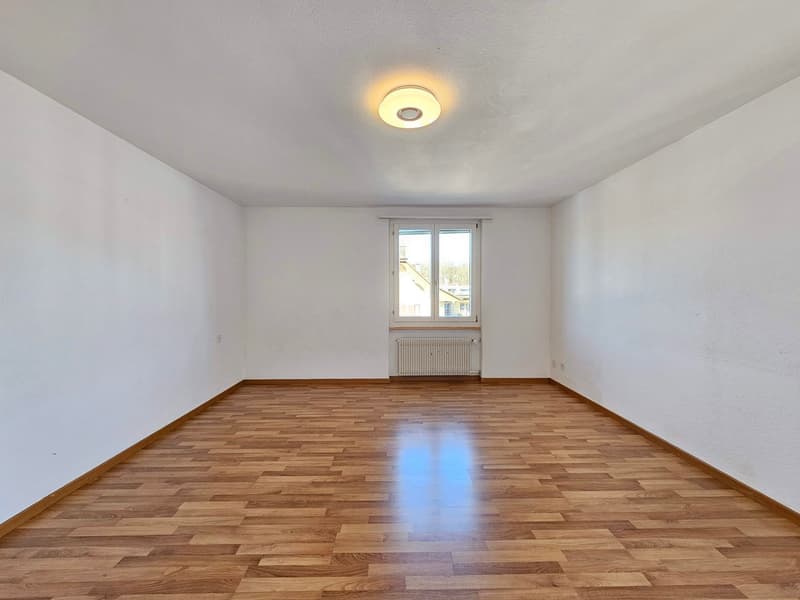 empty room, white walls, wooden floor, ceiling light, window with white frame