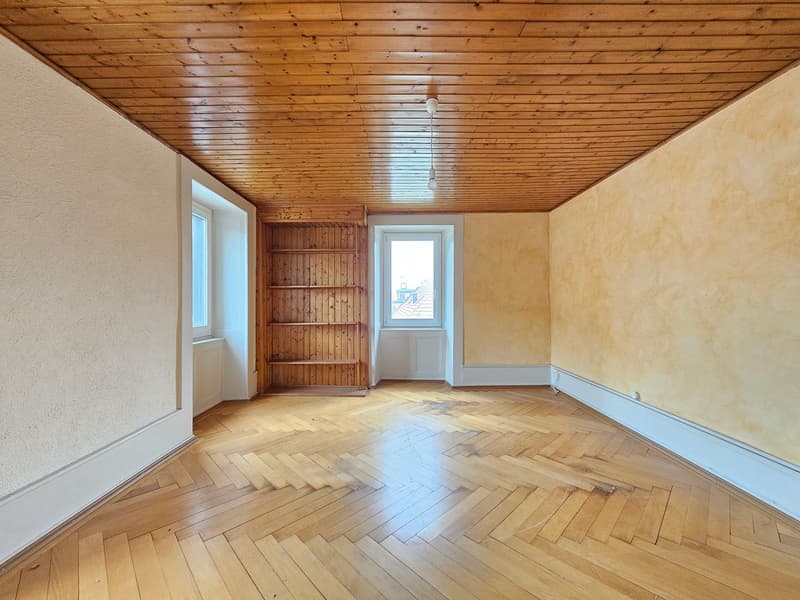 wooden floor, wooden ceiling, white walls, white windows, wooden shelf, light fixture