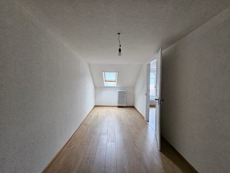 empty room, wooden floor, white walls, small window, open door, ceiling lamp