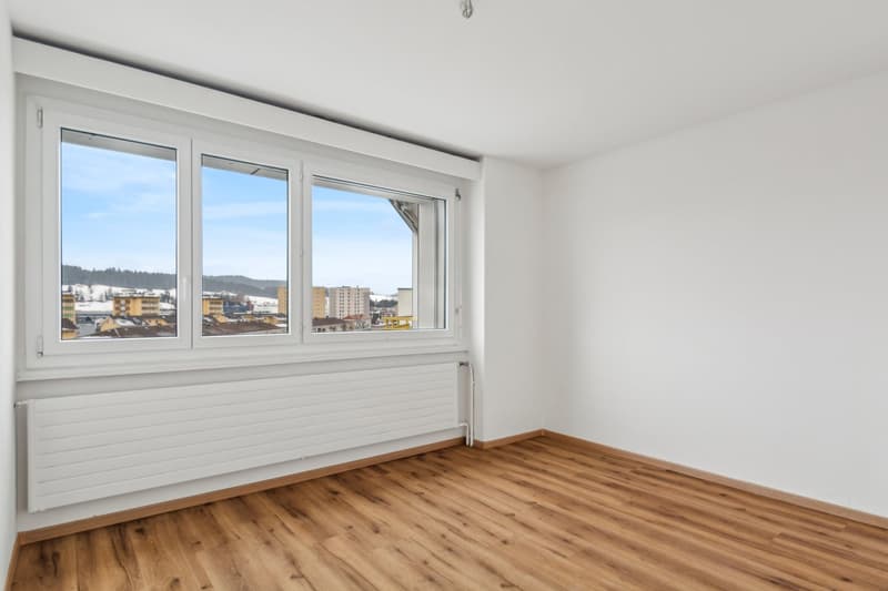 large window, wooden floor, empty room, large window view of the city
