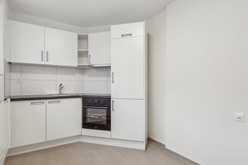 kitchen, modern white cabinets, tile floor, dishwasher, washing machine, electric stove, sink, power outlet