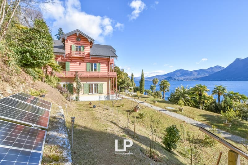 3-storey house with stunning view of the lake, red brick, gable roof, solar panels, red shutters, garden, solar panels