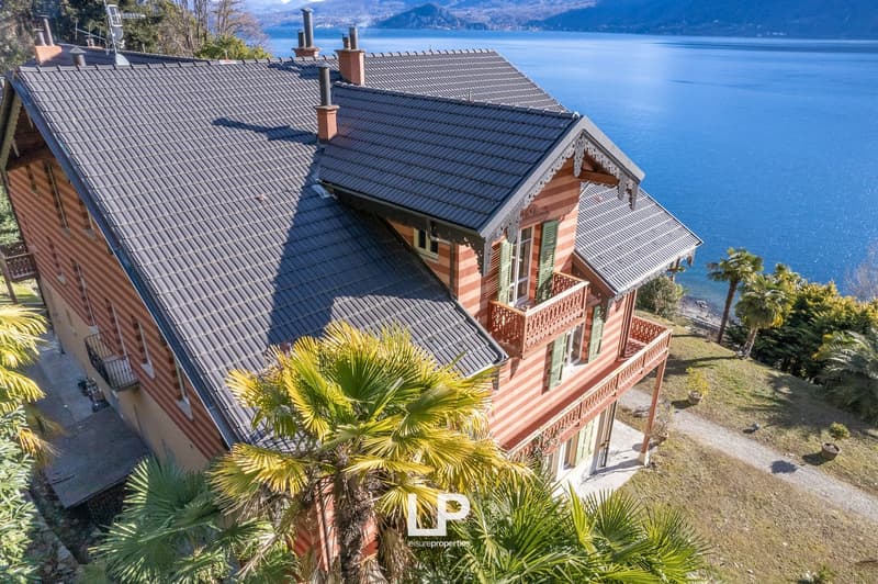 2 story house, grey roof, lake view, balcony