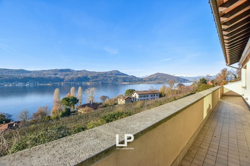 large balcony overlooking lake and mountains
